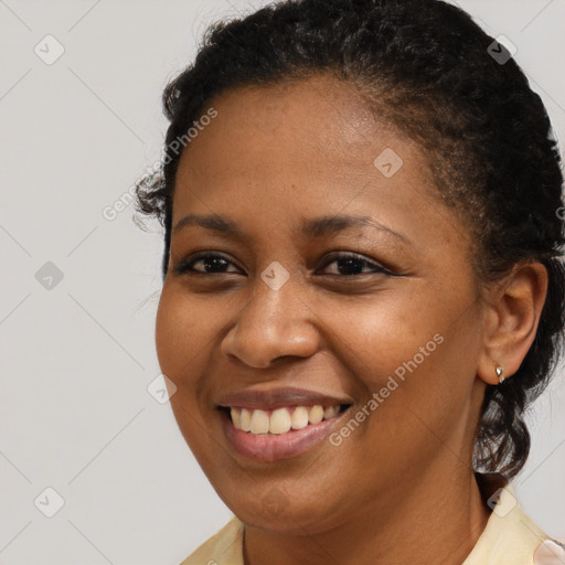 Joyful black young-adult female with short  brown hair and brown eyes