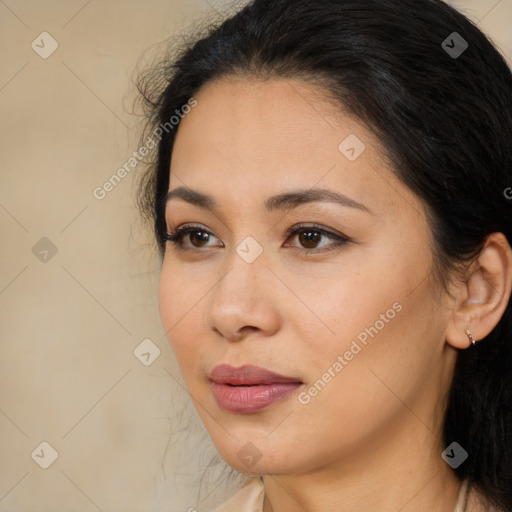 Joyful latino young-adult female with long  brown hair and brown eyes