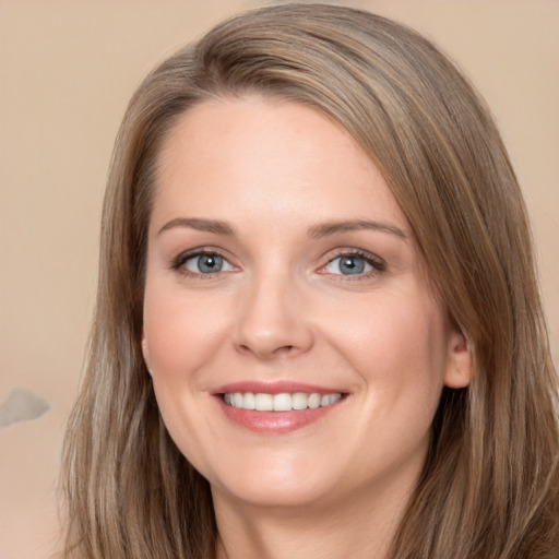 Joyful white young-adult female with long  brown hair and grey eyes