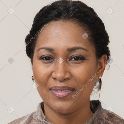 Joyful black adult female with short  black hair and brown eyes