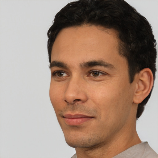 Neutral white young-adult male with short  black hair and brown eyes