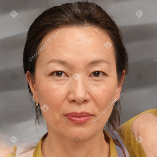 Joyful white adult female with medium  brown hair and brown eyes