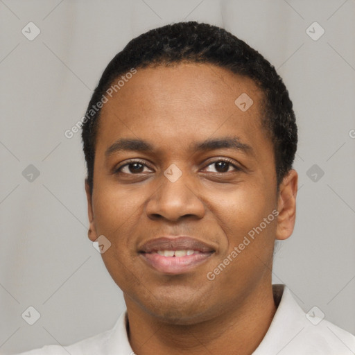 Joyful black young-adult male with short  black hair and brown eyes