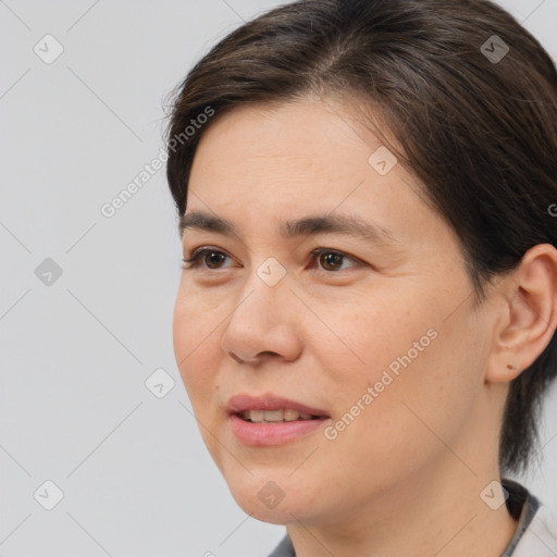 Joyful white adult female with medium  brown hair and brown eyes