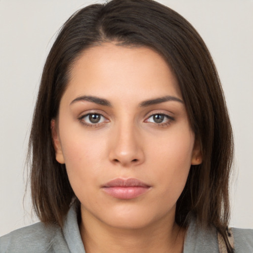 Neutral white young-adult female with long  brown hair and brown eyes