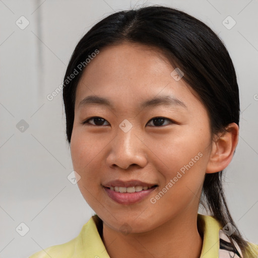 Joyful asian young-adult female with medium  brown hair and brown eyes