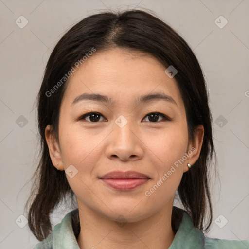 Joyful asian young-adult female with medium  brown hair and brown eyes