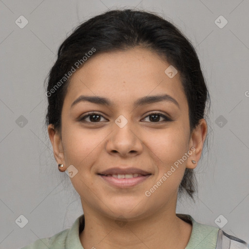 Joyful latino young-adult female with short  brown hair and brown eyes