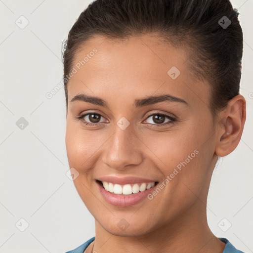 Joyful white young-adult female with short  brown hair and brown eyes