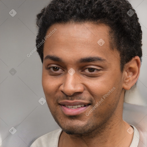 Joyful black young-adult male with short  brown hair and brown eyes