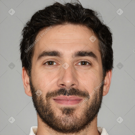 Joyful white young-adult male with short  black hair and brown eyes