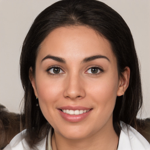 Joyful white young-adult female with medium  brown hair and brown eyes