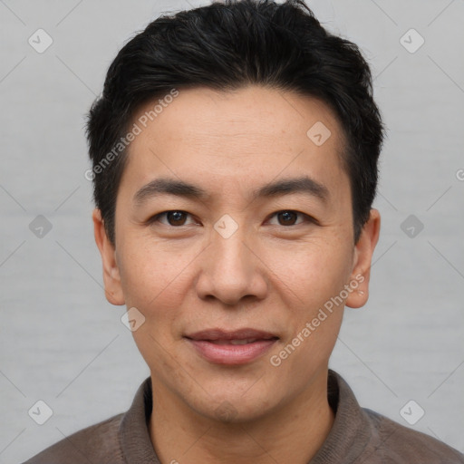 Joyful white adult male with short  black hair and brown eyes