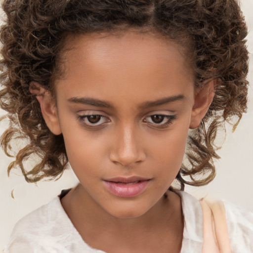 Joyful white child female with medium  brown hair and brown eyes