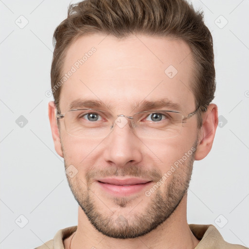 Joyful white adult male with short  brown hair and grey eyes