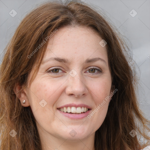 Joyful white adult female with long  brown hair and grey eyes