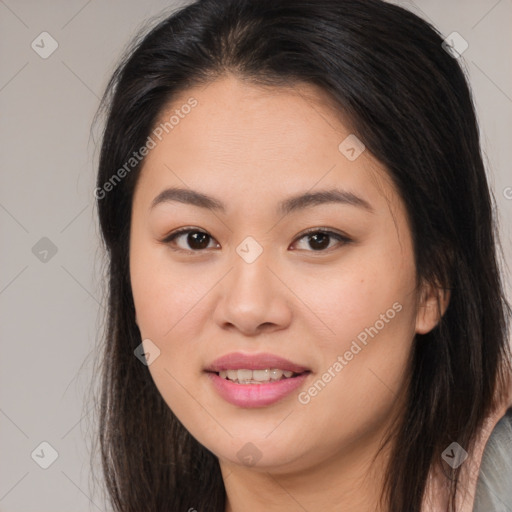 Joyful asian young-adult female with long  brown hair and brown eyes