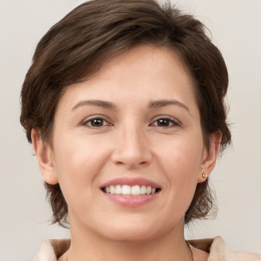 Joyful white young-adult female with medium  brown hair and brown eyes