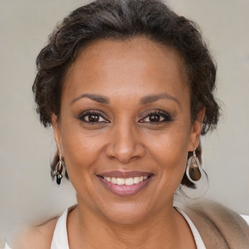 Joyful white adult female with short  brown hair and brown eyes