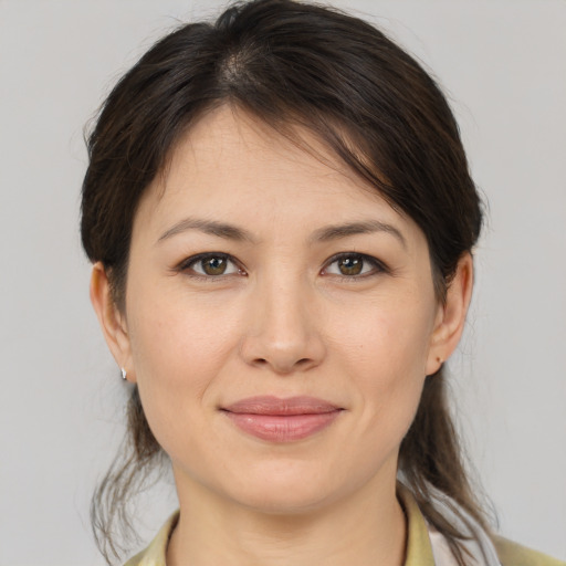 Joyful white young-adult female with medium  brown hair and brown eyes