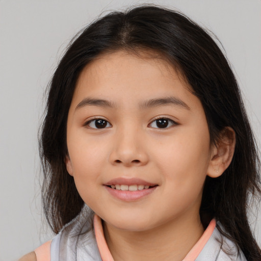 Joyful white child female with medium  brown hair and brown eyes