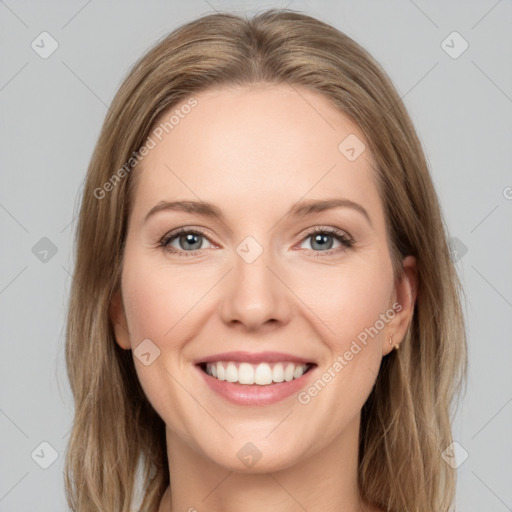 Joyful white young-adult female with long  brown hair and green eyes