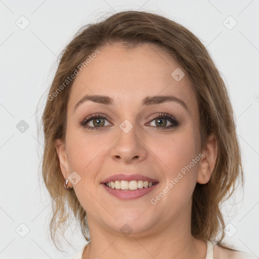 Joyful white young-adult female with medium  brown hair and grey eyes