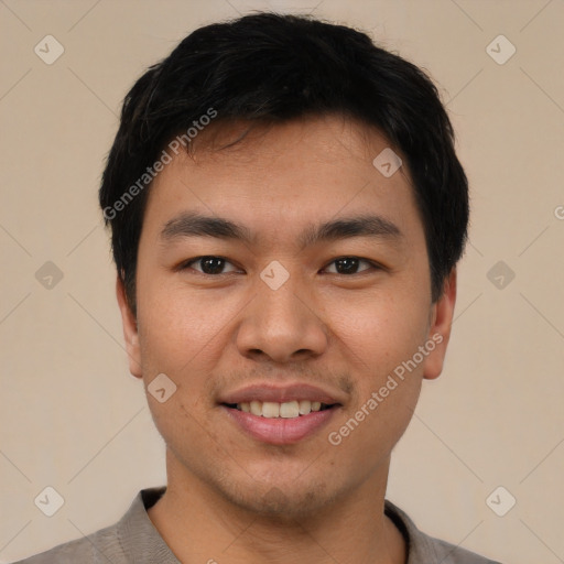 Joyful white young-adult male with short  black hair and brown eyes