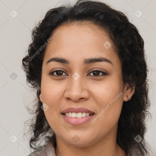 Joyful latino young-adult female with long  brown hair and brown eyes