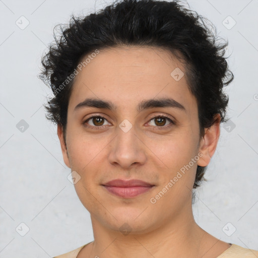 Joyful latino young-adult male with short  brown hair and brown eyes