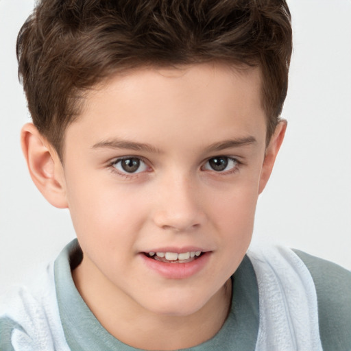 Joyful white child male with short  brown hair and brown eyes