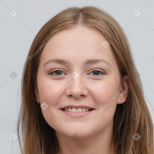 Joyful white young-adult female with long  brown hair and grey eyes