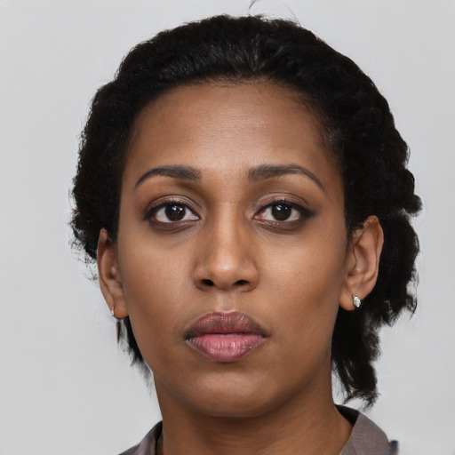 Neutral black young-adult female with short  black hair and brown eyes