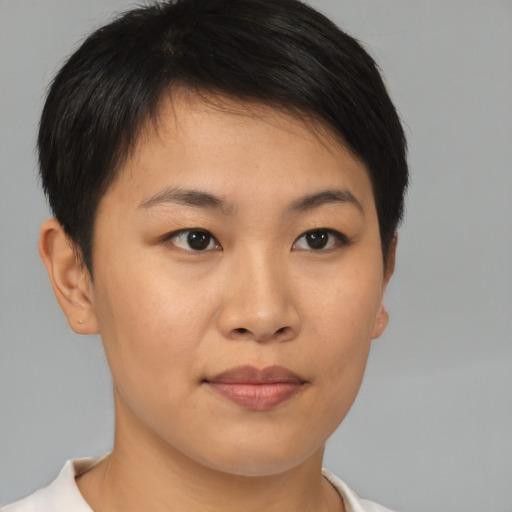 Joyful asian young-adult female with short  brown hair and brown eyes