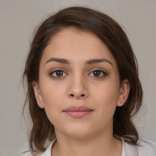 Neutral white young-adult female with medium  brown hair and brown eyes