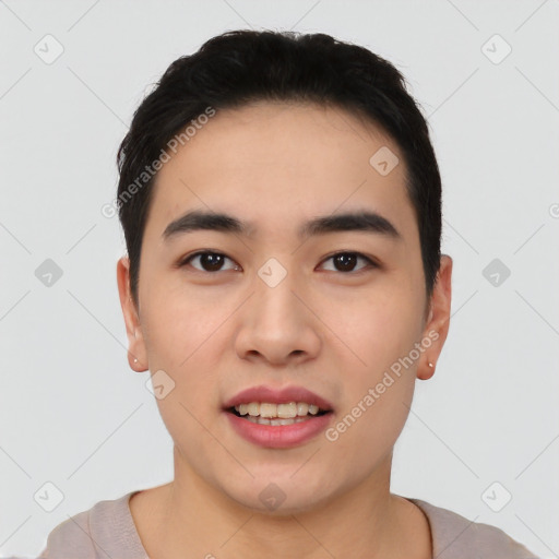 Joyful asian young-adult male with short  black hair and brown eyes