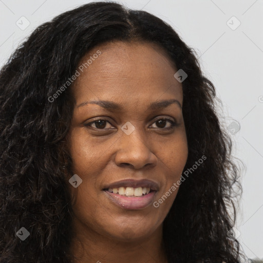 Joyful black young-adult female with long  brown hair and brown eyes