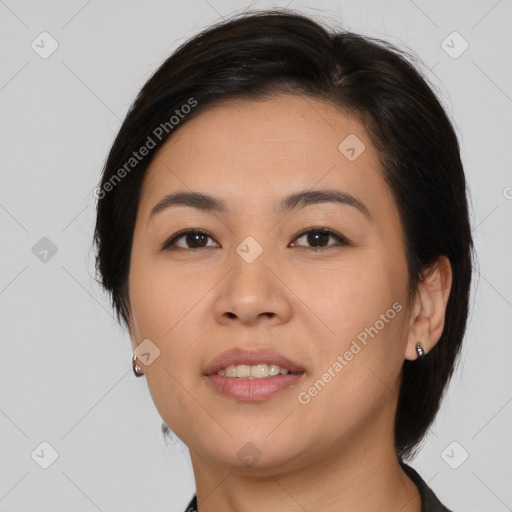 Joyful asian young-adult female with medium  brown hair and brown eyes