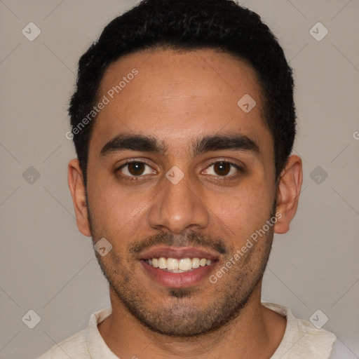 Joyful white young-adult male with short  black hair and brown eyes