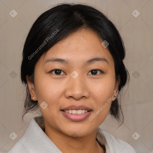 Joyful asian young-adult female with medium  black hair and brown eyes