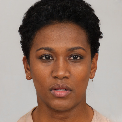 Neutral black young-adult female with short  black hair and brown eyes