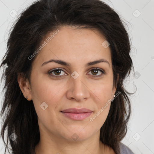 Joyful white adult female with long  brown hair and brown eyes