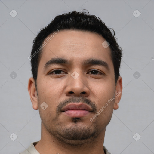 Neutral latino young-adult male with short  black hair and brown eyes