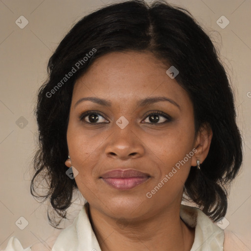 Joyful black adult female with medium  brown hair and brown eyes