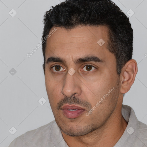 Neutral white young-adult male with short  black hair and brown eyes