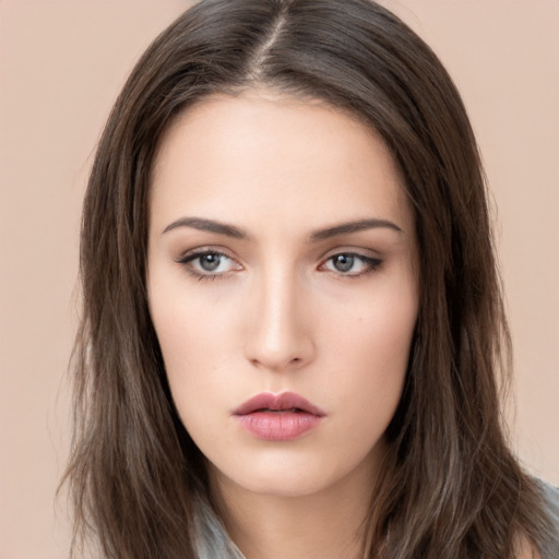 Neutral white young-adult female with long  brown hair and brown eyes