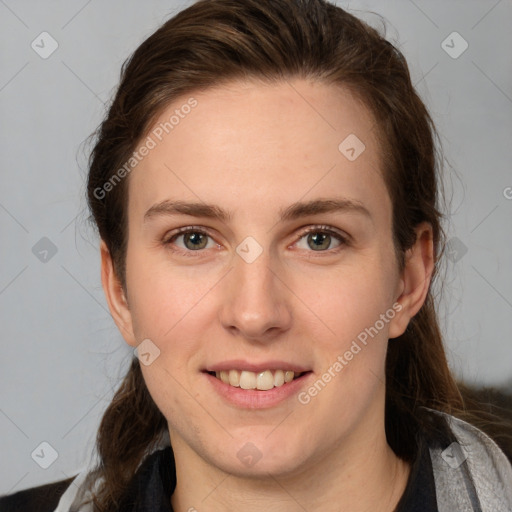 Joyful white young-adult female with medium  brown hair and grey eyes