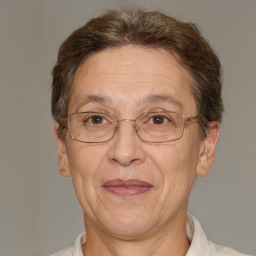 Joyful white middle-aged female with short  brown hair and brown eyes