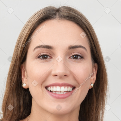 Joyful white young-adult female with long  brown hair and grey eyes