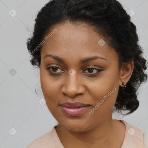 Joyful black young-adult female with long  brown hair and brown eyes